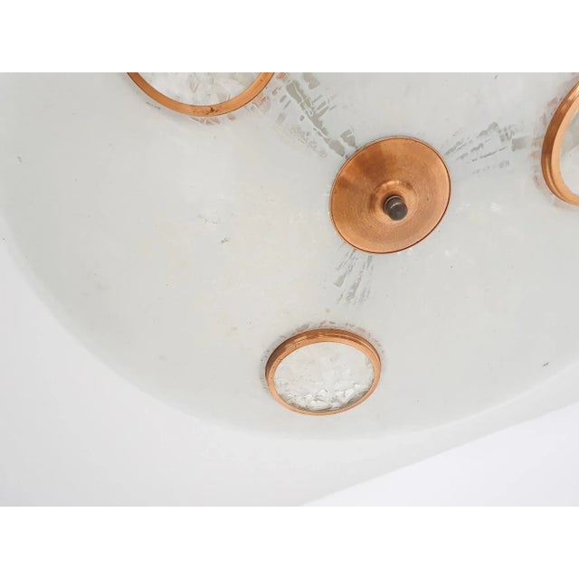 About this item Large glass scale pendant light with brass and copper colored details. The light needs 3x E27 light bulbs...