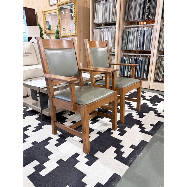 A beautifully crafted pair of Stickley upholstered cottage arm chairs inspired by the enduring principles of American Arts...