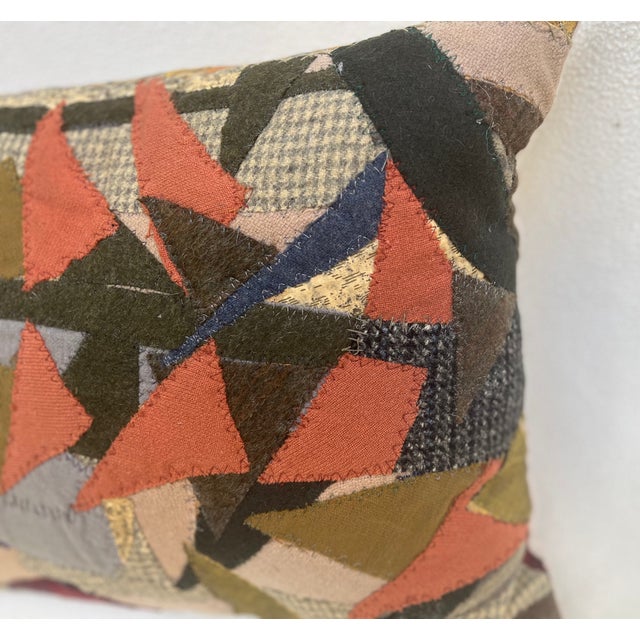 This is a pillow upholstered with a patchwork. An artisanal masterpiece for the curated home. The size is 16 X 13 X 5...