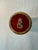 This unique cylindrical box, monogrammed with the letter "E," is crafted from red enamel and adorned with stones and...