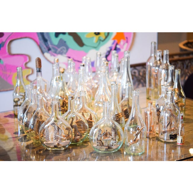 Set of forty glass bottles, Savoyard popular art with wooden decoration inside.