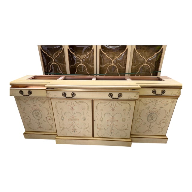 A monumental two-piece breakfront and matching credenza buffet by Karges Furniture of Evansville, Indiana, acquired new in...