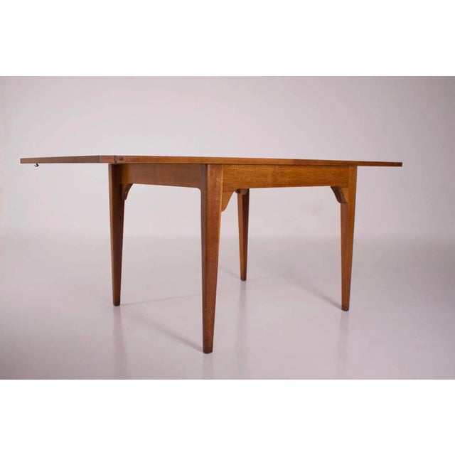 Retractable “portfolio” table, in blond oak. French work late 1940/early 1950, period of reconstruction. Refurbished by...