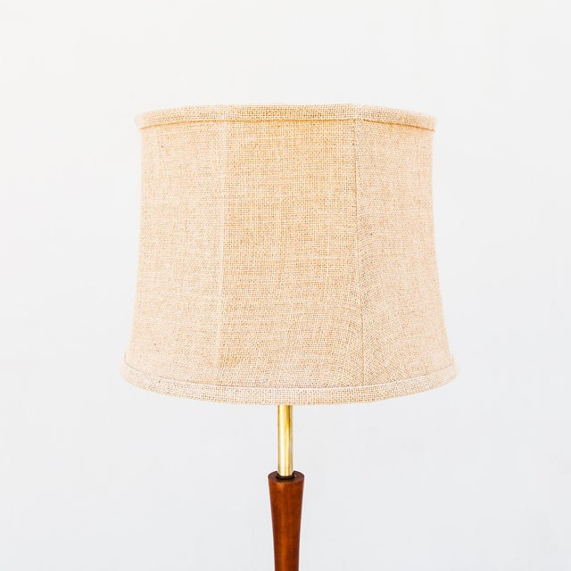 Gorgeous mid century modern walnut floor lamp with built-in 18” side table, fully restored for another century of use. The...