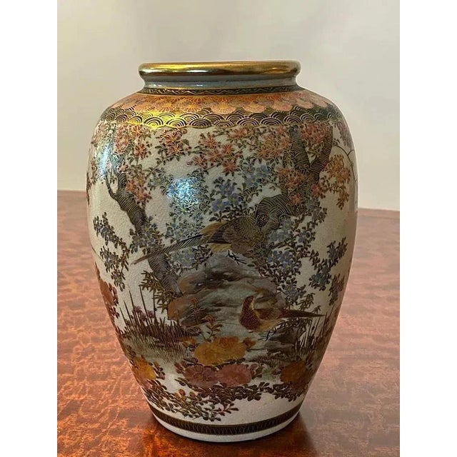 Extremely fine pair of Japanese hand-painted porcelain vases from the 1920s. Size 4' x 8'. Please let us know if you need...
