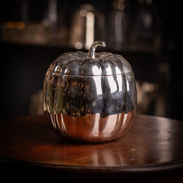 A vintage 20th century italian silver plated ice bucket in the form of a pumpkin. Upon lifting the lid a glass liner is...