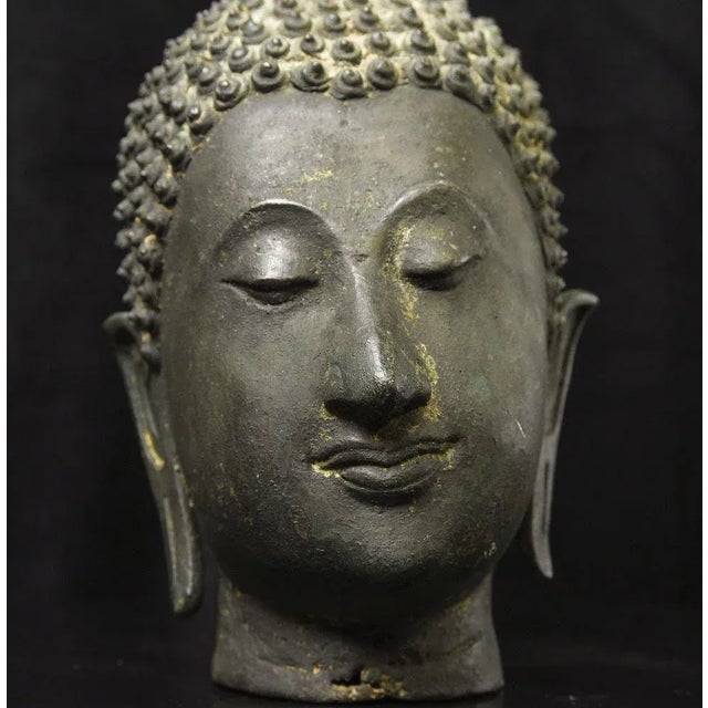 Antique Thai Bronze Head of the Walking Buddha, Sukhothai Tradition An exceptional antique Thai bronze head from a near...