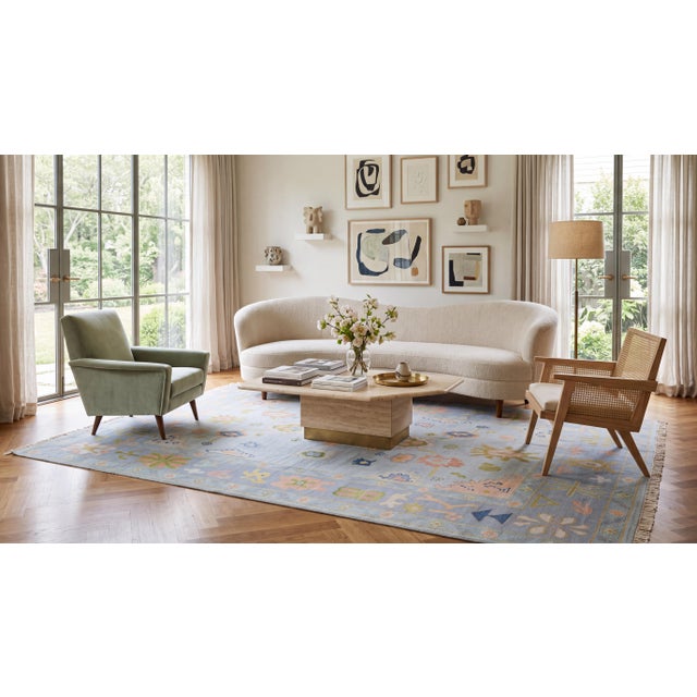 Elevate your space with this hand-knotted modern Oushak style area rug, crafted from premium wool. Featuring a serene ice-...