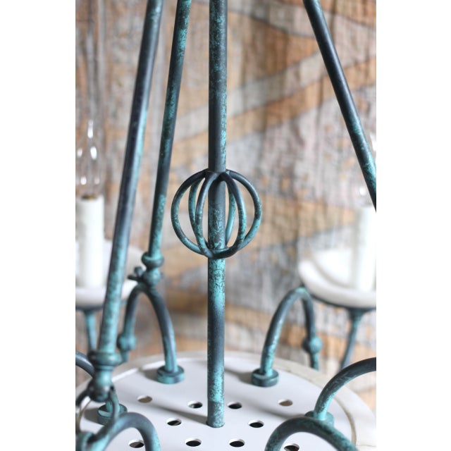 A large hanging pendant chandelier in alabaster and painted verdigris. 1980s or 1990s but with an antique style. Green...