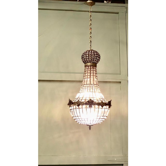 Large French Empire Style Balloon Chandelier A Fine Piece, with an age darkened Brass metal frame and set with crystal...