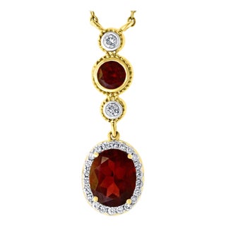 6 Carat Oval Shape Garnet and 0.6 Carat Diamond Necklace in 14 Karat Yellow Gold For Sale