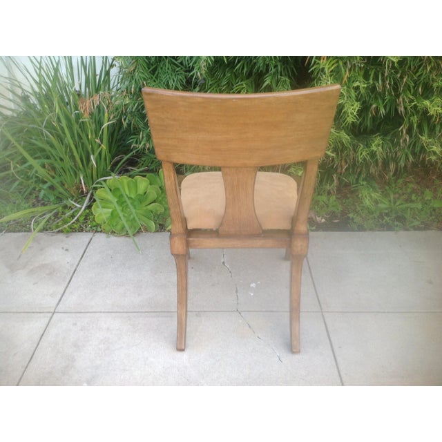 Klismos style side chair with unique Zembrano finish. The cushion is a tan colored suede upholstered seat. The chair is in...