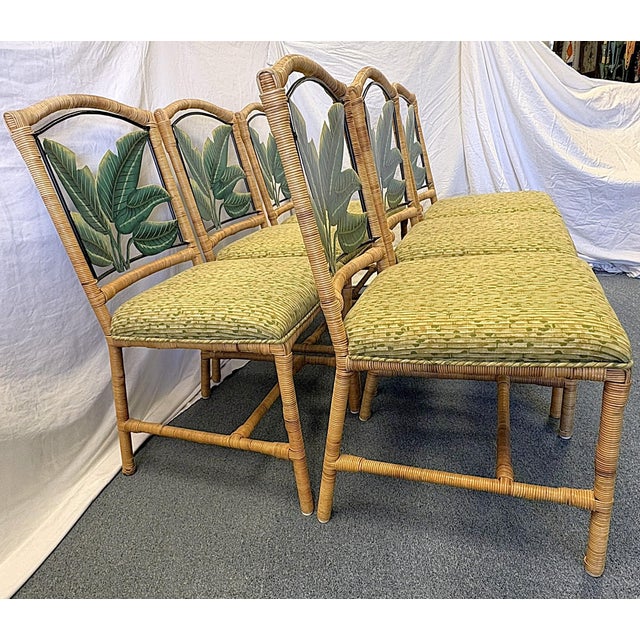 Vintage set of six McGuire Style dining chairs from the late 20th century. They have heavy metal frames wrapped in natural...