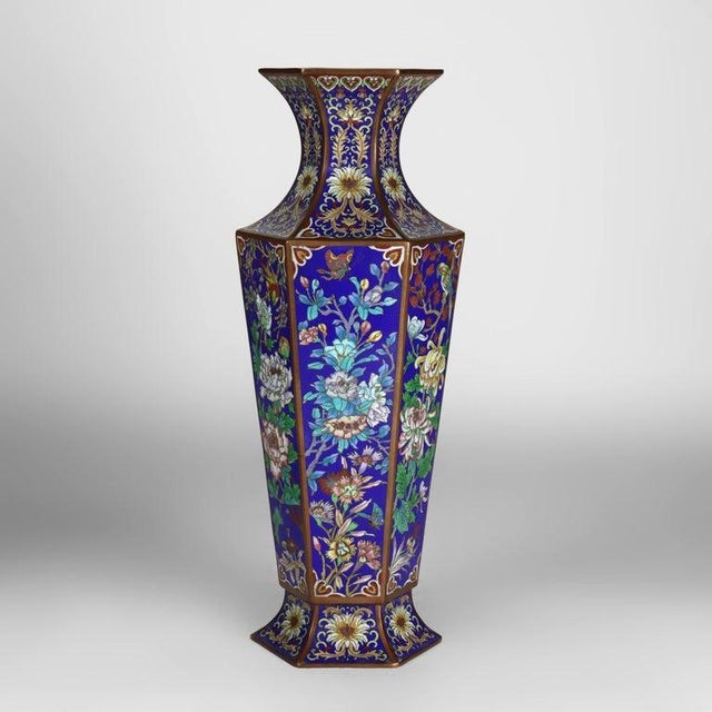 Presenting a magnificent pair of antique Chinese cloisonné enameled bronze vases, dating to approximately C1920. These...