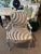 Add bold sophistication to your space with this striking metallic zebra-patterned armchair. Featuring a shimmering silver...