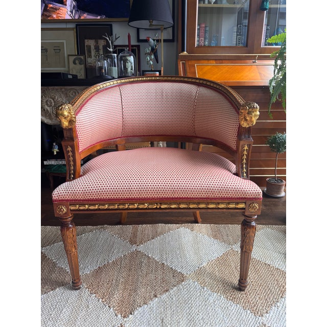 Gustavian Style lion head klismos chair. Gilded lion head and rosettes along the chair. Generous seating and extremely...