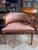 Gustavian Style lion head klismos chair. Gilded lion head and rosettes along the chair. Generous seating and extremely...