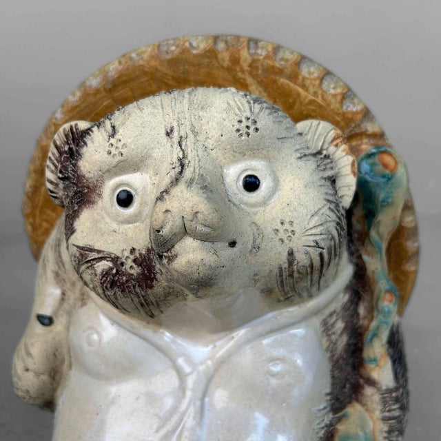 Beautifully weathered Tanuki statue made of Shigaraki pottery, 1970s, Shōwa period, Japan. This Tanuki statue, crafted...