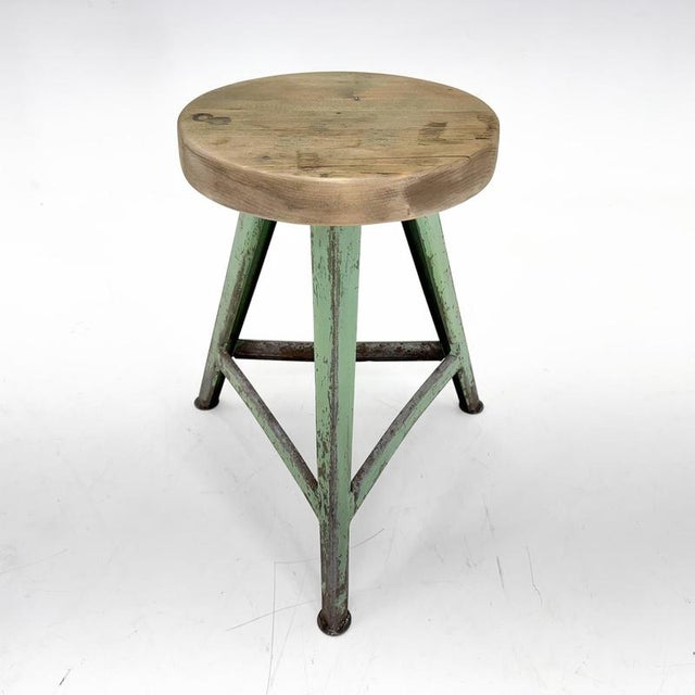 Vintage industrial tripod stool, made of steel and wood. Saved from a factory in former Czechoslovakia. The diameter of...