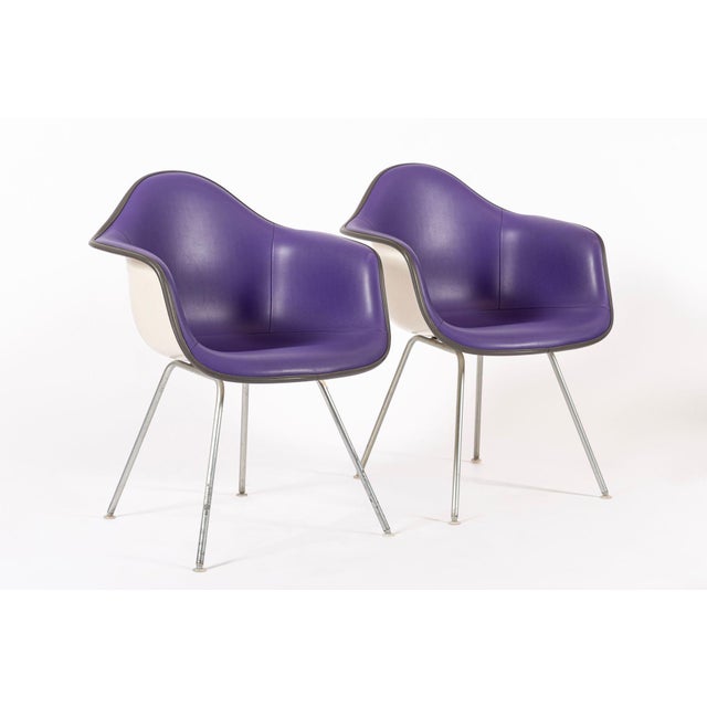 These vintage mid century modern purple DAX bucket lounge chairs designed by Charles and Ray Eames for Herman Miller were...