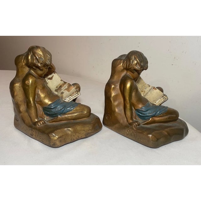 Up for sale is a wonderful pair of antique 19th century figural bronze clad bookends made by Armor Bronze Co.. Each is in...