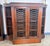 A refined and beautifully proportioned pair of English Regency–style mahogany bookcases, dating from the early 20th...