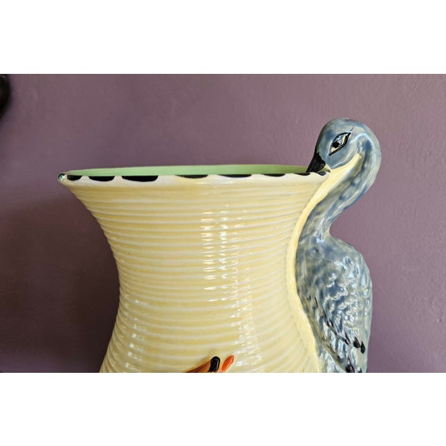 Art deco flower jug by burleigh ware. hand painted with the fox and stork design inspired by aesop”s fables the wolf and...
