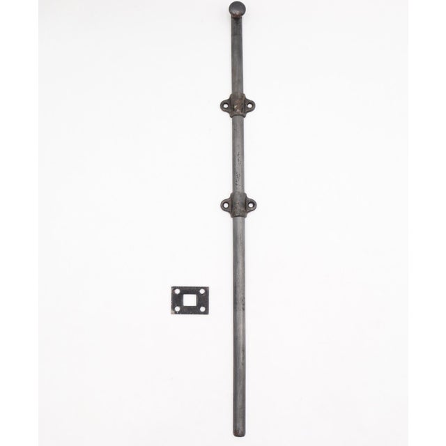 Vintage surface mount slide door bolt made of steel with a dark gray-black finish. The original mounting screws are not...