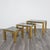 A stunning set of coffee tables, made entirely of gold-colored metal and featuring a smoked glass top. The item is in good...