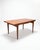 Vintage Scandinavian honey teak dining table designed by Johannes Andersen for Uldum Møbelfabrik (Denmark, circa 1960)....