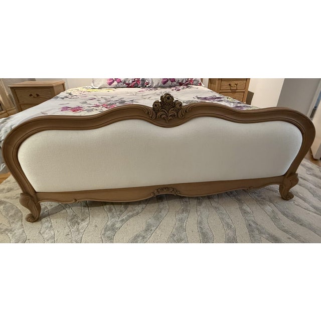 French Louis XV Upholstered bed frame, a reclaimed weathered satin finish upholstered; exhibits features typical of Rococo...