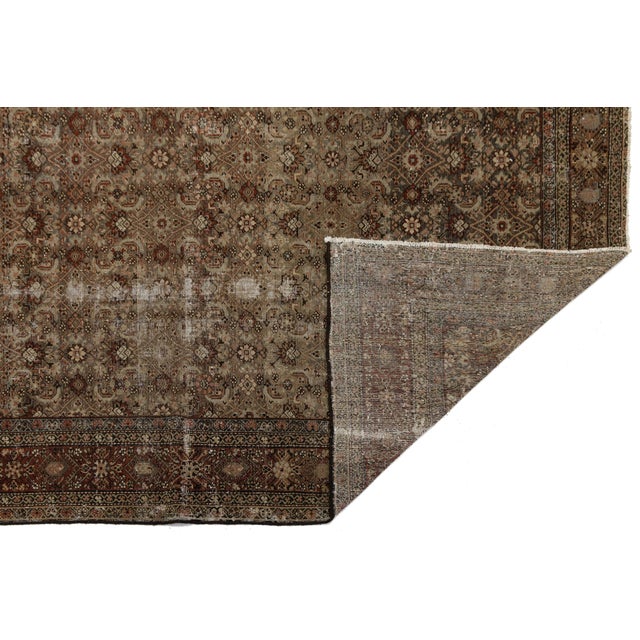 Elevate your space with the timeless elegance of this Antique Hamadan wool rug. Masterfully hand-knotted, it features a...