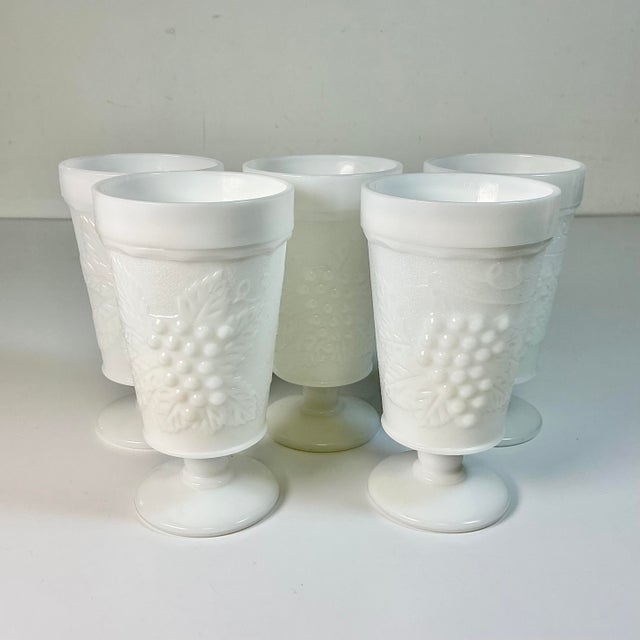 Offering a set of 5 Pedestal Ice Tea Tall Glasses. They are Grape Milk Glass from the 1950s and by Big Top Crystal. They...