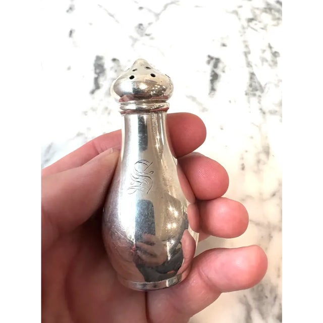 Antique Monogramed and stamped S. Kirk & Son Co sterling silver salt shakers with a monogramed S marked on each shaker....
