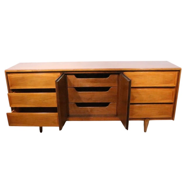 Elegant and sophisticated Mid Century, Hollywood Regency style low dresser made by American of Martinsville. The dresser...