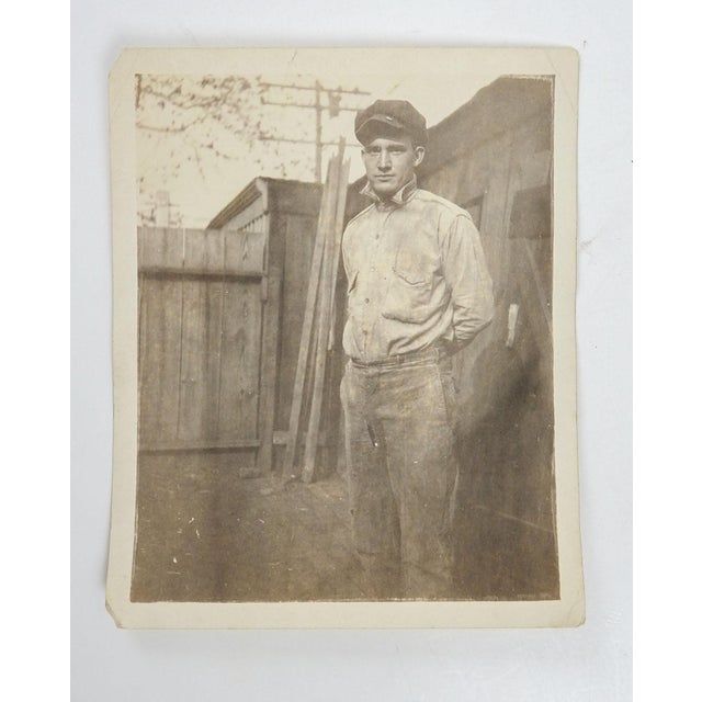 Early 20th century silver gelatin vernacular snapshot photograph of handsome working man. Unframed, small corner loss and...