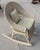 This fine child's wicker rocking chair is in fine condition and has a newly upholstered in leather with a little leather...