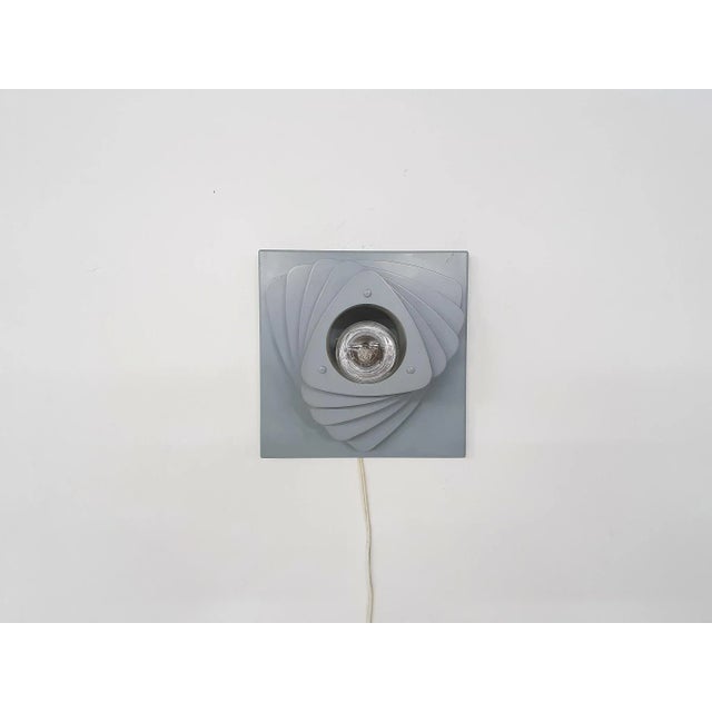 Grey metal wall light with multiple layers. In the style of Anvia or Louis Poulsen In good condition Up to 250V (Europe/UK...