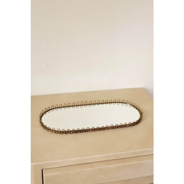 Charming Swedish Mid-Century Oval Mirror tray in brass and glass with an oval filigree design. In good vintage condition...