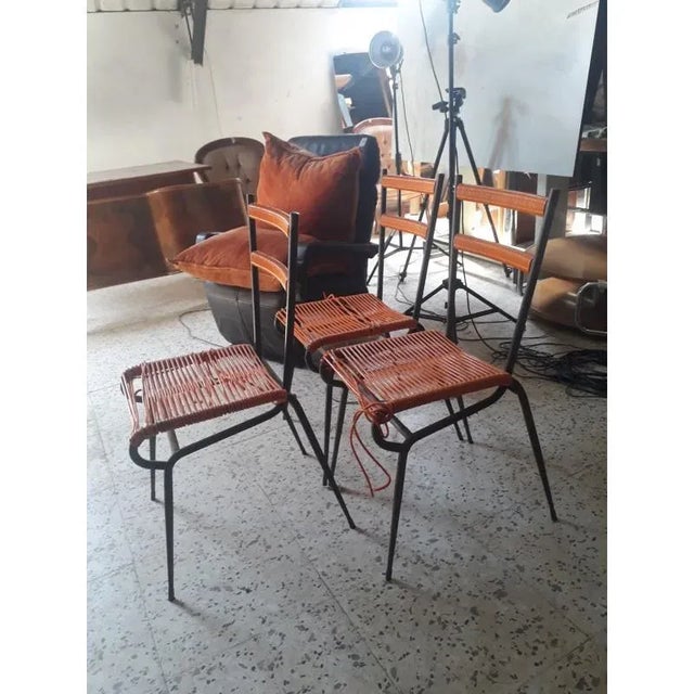 Iron chair with seat and back in plastic orange intrecciata. Original 60s. Size 40 cm x 40 x 87 x h 46 h. The chairs have...