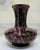 Bring home a vintage polished Bidasar red stone vase with dramatic natural veining and a rich marbled palette of deep red,...