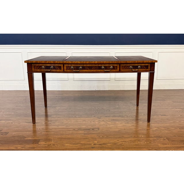 This is a Traditional Mahogany Hepplewhite Writing Desk by Leighton Hall. It is ideal for the home office, library or...