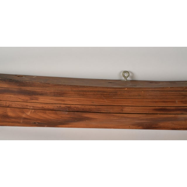 A Half-Hull Boat Model with added hanging eye hook Beautiful wood grain for a simple nautical look. Great above a doorway,...