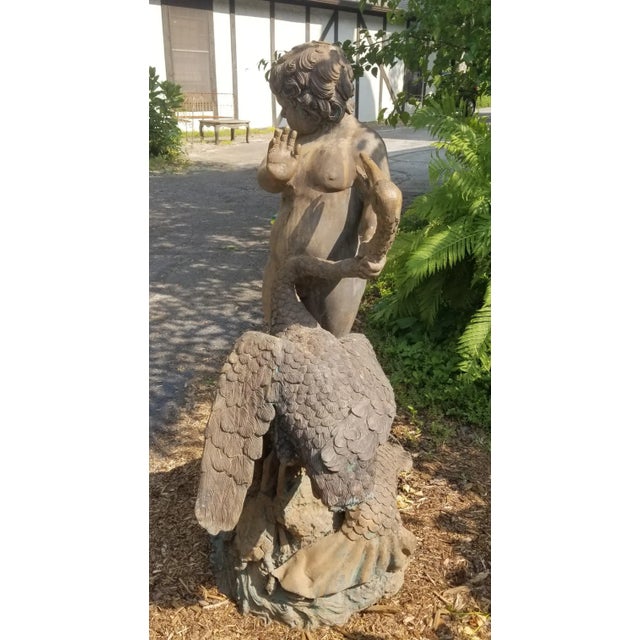 This stunning outdoor piece of art was once an elaborate fountainhead. You can see the original spigot fixtures in the...