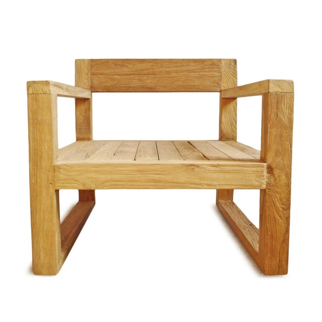 Simple modern outdoor teak wood club chair. Each may vary in natural wood tones and grain. Seat height is 14" without...