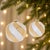 Elevate your holiday decor with this set of Distressed Glass Ball Ornaments. Featuring festive gold and silver tones with...
