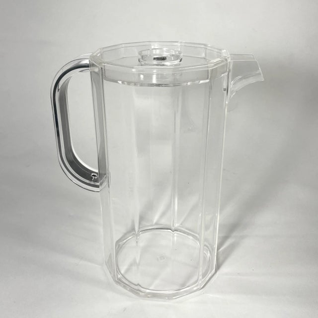 Post Modern Italian Guzzini Lucite Pitcher with lid. Sourced in Milan, Italy.