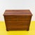 This magnificent solid wood chest of drawers is a true gem of vintage design. With a nod to classicism, it features four...