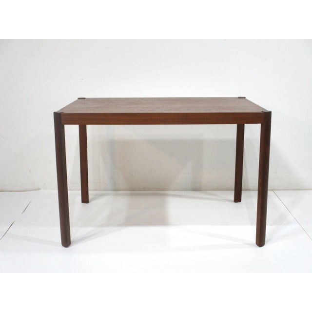 A nice well crafted teak wood side/end table with great graining having angled rosewood legs to each corner . The mix of...