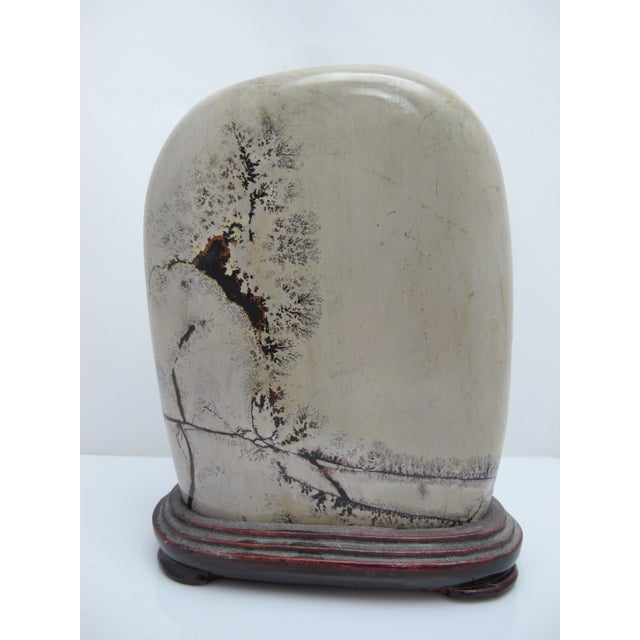 Chinese dream stone or siltstone boulder with custom carved wood stand. Siltstone (or "grass and flower stone") boulders,...